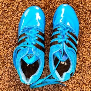 Lightning blue Nike spikes